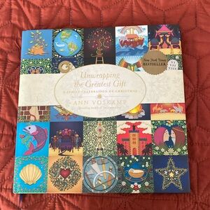 Book - unwrapping the greatest gift Hardback with paper sleeve